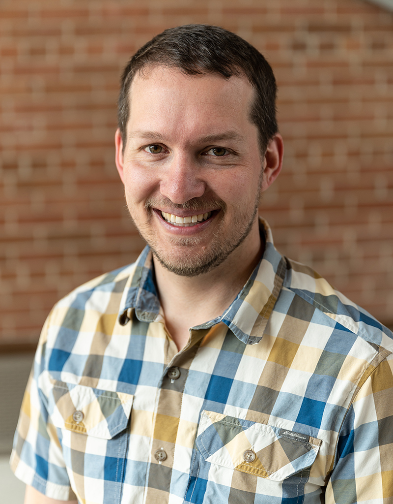 Berkley Walker. A scientist in a checkered shirt