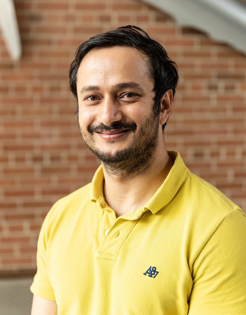 Binod Basyal, a scientist in a yellow shirt